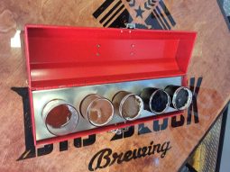 Beer samples served in red tool box.